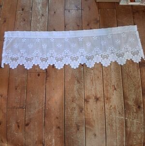 Lovely 66" L white heritage lace with floral design valance.